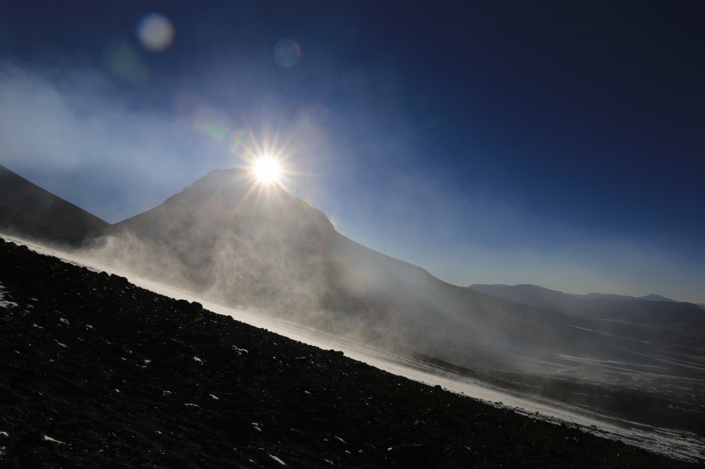 As the sun is rising behind Agua Caliente, the snow drifts can be seen both on the mountain far away and in the snow and ash field we're walking up on. Further wisps you can see are smoke from the volcano. It's not particularly friendly to our ascent this time and blows all the hydrogen sulfide and other nasties down our way!