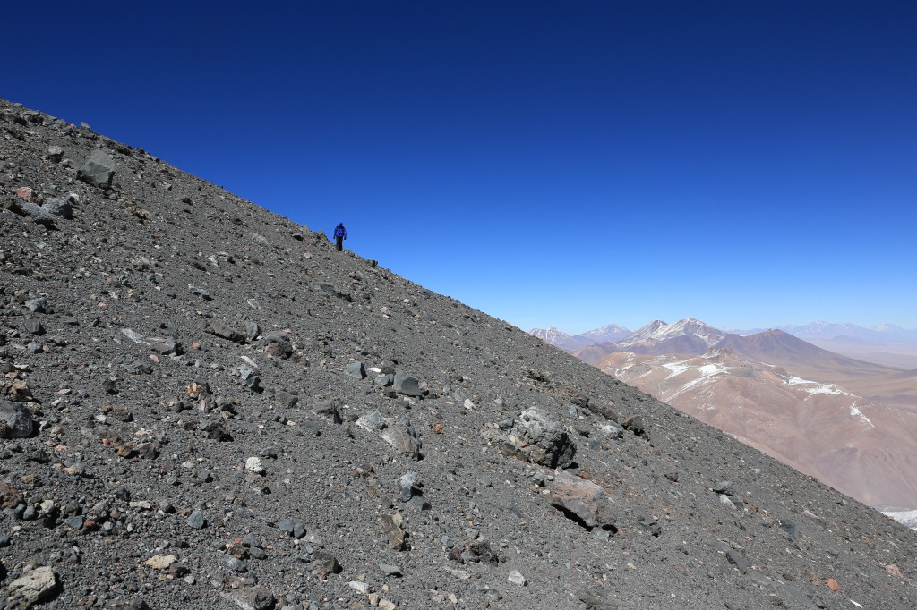 Time for the descent! This is where my ultra marathoning leg muscle gave me an unfair advantage... Here I'm looking back at Christof coming across the basalt field near the peak. Look at huge some of those ejecta are!